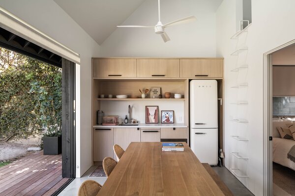 The ADU's kitchenette is tucked into one side of the structure, with a ladder leading to a carpeted playroom for the kids. "It's a great example of a family home that doesn't always look like it,