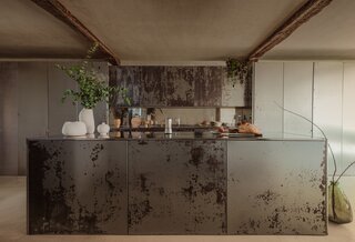 The kitchen is composed of stainless steel, from the cabinetry fabricated by Barcelona company Timblau, to the counters and backsplash, the latter given a mirror polish for contrast to the former’s patina on the surfaces. The boxes were brought in on a crane and then the group put them together in place. “The kitchen shouldn't be a closed dirty area of the house,” says Jon. “But [rather] the heart.” Fitting, as social life in the Basque culture revolves around eating together.