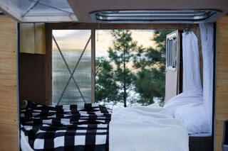 The large skylight over the bed was a necessary addition for Peterson-Hui. Polycarbonate panels let in light without making the camper a fishbowl. At night, campers slide the curtains (which are shower curtains cut short) closed for extra privacy.
