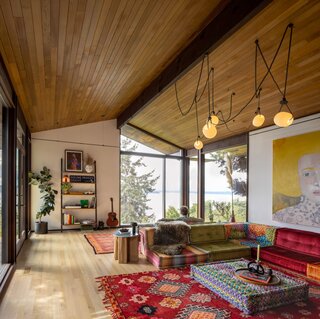 The original layout was very much of the time: a perfect midcentury modern flow, with a closed-off kitchen and a fire put in the floor. “They were cool but impractical spaces,” says Schaer. 