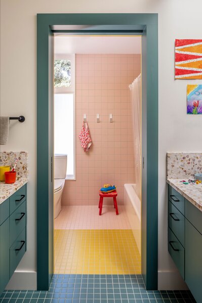 In the kids bathroom, Ceramica Vogue tile in multiple colors brings a youthful quality. Countertops are by Concrete Collaborative.