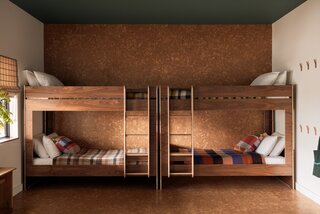 The bunk room features four extra-long bunk beds, allowing the home to sleep 10.
