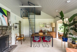 The ladder-like staircase was designed as a modern, whimsical addition to an otherwise midcentury-focused design. "I use it as a drying rack,