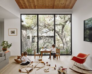 The long-leaf-pine roof decking was salvaged from the original home and used on the ceiling in the new playroom.