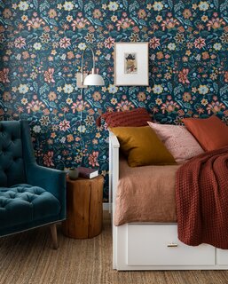 The Marigold wallpaper from York Wallcoverings adorns one room, its turquoise and saffron shades shaping the color scheme.