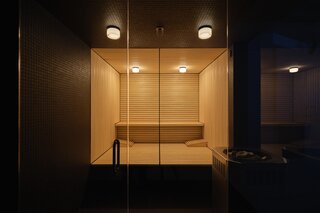 The same Daltile wraps the sauna interior for continuity.